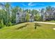 Scenic view of the home's exterior, showcasing its beautiful landscaping and architectural details at 1065 Low Water Crossing Nw, Acworth, GA 30101