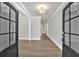 Bright foyer featuring hardwood floors, elegant trim, and a view of the home's open layout at 1065 Low Water Crossing Nw, Acworth, GA 30101