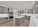 Modern kitchen featuring gray cabinets, a center island with quartz countertop, and stainless steel appliances at 1065 Low Water Crossing Nw, Acworth, GA 30101