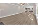Spacious living room featuring hardwood floors, large windows and doorway view into kitchen at 1065 Low Water Crossing Nw, Acworth, GA 30101