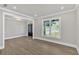 Living room with wood flooring and an open doorway at 1065 Low Water Crossing Nw, Acworth, GA 30101