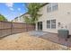 Backyard with a small patio, partial fence, grass and mature landscaping at 2183 Miranda Dr, Morrow, GA 30260