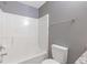 Clean bathroom featuring a white shower-tub combination and a granite-look countertop at 2183 Miranda Dr, Morrow, GA 30260