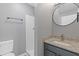 A full bathroom featuring granite countertop, updated fixtures, and shower at 2183 Miranda Dr, Morrow, GA 30260