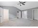Spacious bedroom with vaulted ceiling, neutral walls, plush carpet and ceiling fan at 2183 Miranda Dr, Morrow, GA 30260