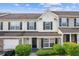 Charming two-story townhome with a manicured front yard and attached garage at 2183 Miranda Dr, Morrow, GA 30260
