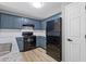 Stylish kitchen with black appliances, and ample counter space at 2183 Miranda Dr, Morrow, GA 30260