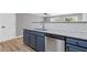 Close up of modern kitchen with granite counters and stainless steel dishwasher at 2183 Miranda Dr, Morrow, GA 30260