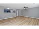 Spacious living room features modern wood-look floors, a ceiling fan and neutral colors at 2183 Miranda Dr, Morrow, GA 30260