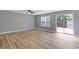 Spacious living area featuring hard wood flooring and sliding glass doors at 2183 Miranda Dr, Morrow, GA 30260