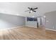 Bright open floor plan includes light, wood-look floors and a ceiling fan at 2183 Miranda Dr, Morrow, GA 30260