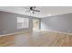This living room offers wood-look floors, sliding door access to outside, and a ceiling fan at 2183 Miranda Dr, Morrow, GA 30260