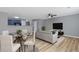 Open-concept living and dining area with modern furnishings and decor at 2183 Miranda Dr, Morrow, GA 30260