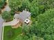 Overhead view of the house surrounded by a lush landscape and a curved driveway at 245 River Laurel Way, Woodstock, GA 30188