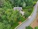 Aerial view of home with manicured lawns and mature trees providing privacy in a serene, residential setting at 245 River Laurel Way, Woodstock, GA 30188