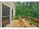 A serene view of the home's backyard featuring a rock garden, stepping stones, and mature trees at 245 River Laurel Way, Woodstock, GA 30188