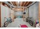 Unfinished basement space with bikes and beanbag chairs at 245 River Laurel Way, Woodstock, GA 30188