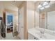 Bathroom with a wide mirror and gray and white tile floors at 245 River Laurel Way, Woodstock, GA 30188