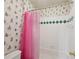 Bathroom with cartoon-themed wallpaper and a pink shower curtain at 245 River Laurel Way, Woodstock, GA 30188