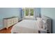 Well-lit bedroom featuring hardwood floors and a hanging swing chair at 245 River Laurel Way, Woodstock, GA 30188