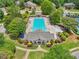 Aerial view of the community pool area, featuring a large pool, seating, gazebo, and well-maintained landscaping at 245 River Laurel Way, Woodstock, GA 30188