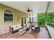 Inviting deck with comfortable seating and a ceiling fan, perfect for enjoying the outdoors at 245 River Laurel Way, Woodstock, GA 30188