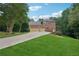 Beautiful home with a long driveway, two-car garage, and well-manicured lawn at 245 River Laurel Way, Woodstock, GA 30188