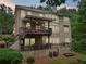 Back exterior showcasing a multi-level deck with a ceiling fan, providing ample space for outdoor entertainment and relaxation at 245 River Laurel Way, Woodstock, GA 30188