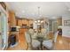 Open kitchen with stainless appliances, breakfast nook, and hardwood floors at 245 River Laurel Way, Woodstock, GA 30188