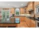 Kitchen with island, stainless appliances, and breakfast nook at 245 River Laurel Way, Woodstock, GA 30188