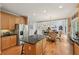 Open kitchen with stainless steel appliances, granite countertops, and custom cabinetry at 245 River Laurel Way, Woodstock, GA 30188