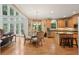 Spacious open concept kitchen with granite counters, island and a breakfast nook with natural light at 245 River Laurel Way, Woodstock, GA 30188