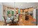 Bright eat-in kitchen featuring stainless appliances, granite countertops, and breakfast area at 245 River Laurel Way, Woodstock, GA 30188