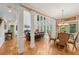 Open concept living space offering natural light, fireplace, and hardwood flooring at 245 River Laurel Way, Woodstock, GA 30188