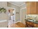 Functional mudroom with built-in desk, and convenient access to the laundry room at 245 River Laurel Way, Woodstock, GA 30188
