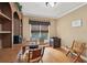 Comfortable home office featuring a built-in desk, wooden floors, and lots of natural light at 245 River Laurel Way, Woodstock, GA 30188