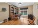 Bright home office with built-in desk, ample shelving, and natural light at 245 River Laurel Way, Woodstock, GA 30188