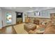 Finished basement featuring a living area with exposed brick wall and comfortable seating at 4075 Hickory Fairway Dr, Woodstock, GA 30188