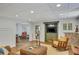 Finished basement featuring a living area with television, brick wall, and comfortable seating at 4075 Hickory Fairway Dr, Woodstock, GA 30188