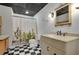 Stylish bathroom with black and white checkered floors and sleek fixtures at 4075 Hickory Fairway Dr, Woodstock, GA 30188