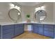 Bathroom features double vanity with framed mirrors and modern lighting at 4075 Hickory Fairway Dr, Woodstock, GA 30188