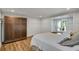 The bedroom features light-colored walls, wood flooring, and a large closet and double doors to the outdoors at 4075 Hickory Fairway Dr, Woodstock, GA 30188