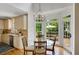 Charming breakfast nook with a chandelier, table and chairs, with views of the outdoor living space at 4075 Hickory Fairway Dr, Woodstock, GA 30188