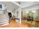 Spacious foyer featuring hardwood floors, an adjacent living room, and home office space at 4075 Hickory Fairway Dr, Woodstock, GA 30188