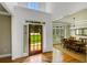 Entryway with hardwood floors leading to the dining room, providing a warm welcome with natural light at 4075 Hickory Fairway Dr, Woodstock, GA 30188