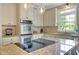 Modern kitchen with stainless steel appliances, granite countertops, and ample cabinet space at 4075 Hickory Fairway Dr, Woodstock, GA 30188