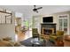 Comfortable living room with fireplace, plush seating, and an open floor plan at 4075 Hickory Fairway Dr, Woodstock, GA 30188