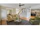 Spacious living area featuring hardwood floors, fireplace and an open flow to the kitchen and dining area at 4075 Hickory Fairway Dr, Woodstock, GA 30188