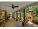 Outdoor patio includes stone flooring, fireplace, and wooded landscape views at 4075 Hickory Fairway Dr, Woodstock, GA 30188