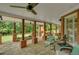 Spacious outdoor patio with brick columns, stone flooring, and a tranquil backyard setting at 4075 Hickory Fairway Dr, Woodstock, GA 30188